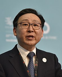 https://upload.wikimedia.org/wikipedia/commons/thumb/1/18/Tenth_WTO_Ministerial_Conference_-_Day_2_-_Plenary_session_Moon_Jae-Do%2C_South_Korea_%2823681842552%29.jpg/220px-Tenth_WTO_Ministerial_Conference_-_Day_2_-_Plenary_session_Moon_Jae-Do%2C_South_Korea_%2823681842552%29.jpg