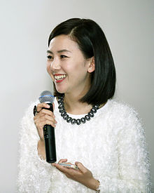 https://upload.wikimedia.org/wikipedia/commons/thumb/7/7f/Kim_Hyeon-jeong_%28%EA%B9%80%ED%98%84%EC%A0%95%2C_painter%29_at_The_Exhibition_of_Three_Korean_Artists_at_Today_Art_Museum_in_Beijing%2C_China.jpg/220px-Kim_Hyeon-jeong_%28%EA%B9%80%ED%98%84%EC%A0%95%2C_painter%29_at_The_Exhibition_of_Three_Korean_Artists_at_Today_Art_Museum_in_Beijing%2C_China.jpg
