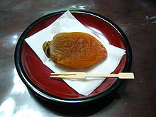 https://upload.wikimedia.org/wikipedia/commons/thumb/b/bb/Dried_Kaki_Fruit.jpg/220px-Dried_Kaki_Fruit.jpg