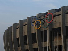 https://upload.wikimedia.org/wikipedia/commons/thumb/d/d3/Seoulolympicstadium2005.JPG/220px-Seoulolympicstadium2005.JPG